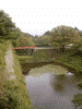茶壺櫓から見た朱塗りの橋と磐梯山