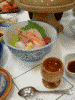 屋久島グリーンホテルの夕食(4)/屋久杉のおちょこに入った食前酒とお刺身